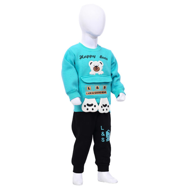 A blue sweater and black pants set for a child, featuring a bear design on the sweater with the text 